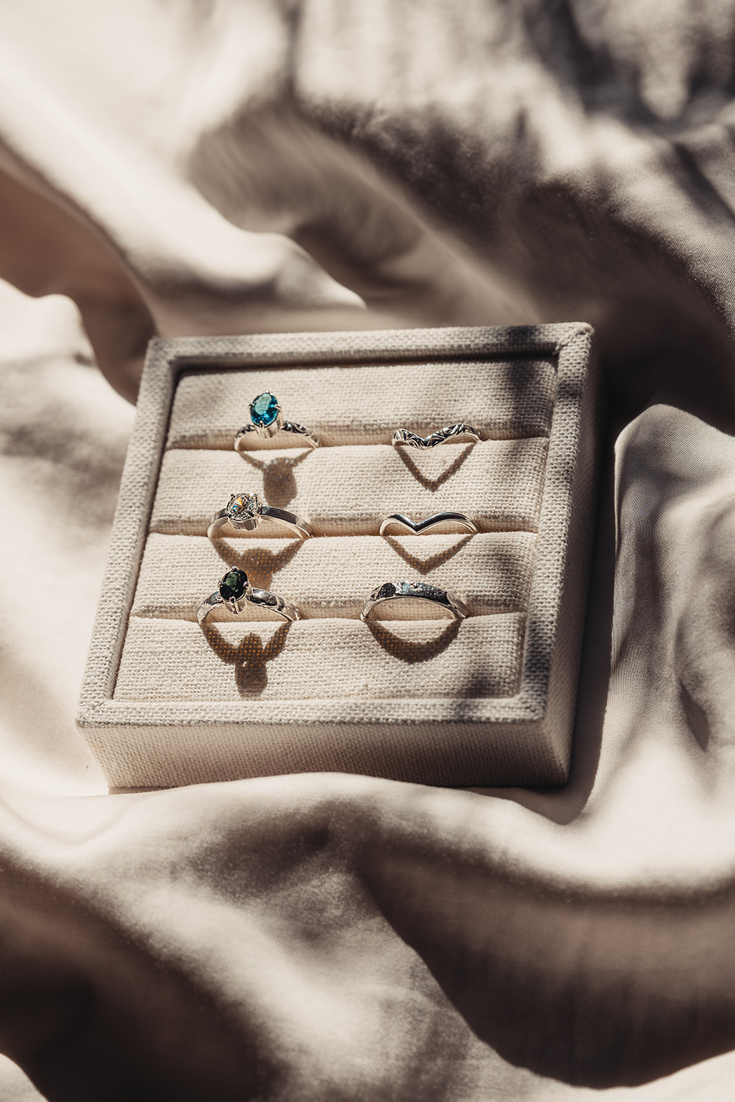 Wedding and engagement bands in a shadow cast 