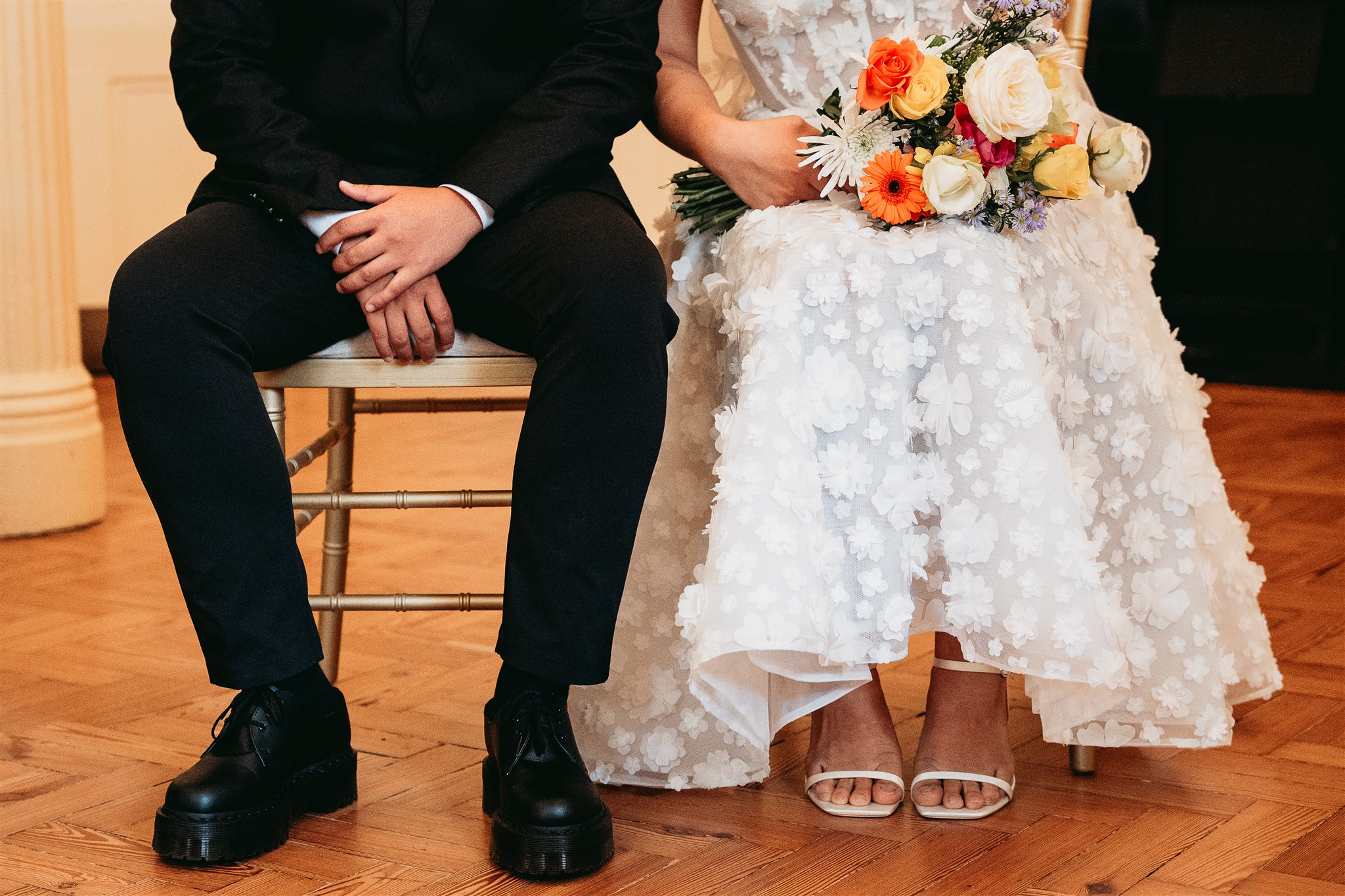 A newly married couple walking through the Council Chamber at Brighton Town Hall