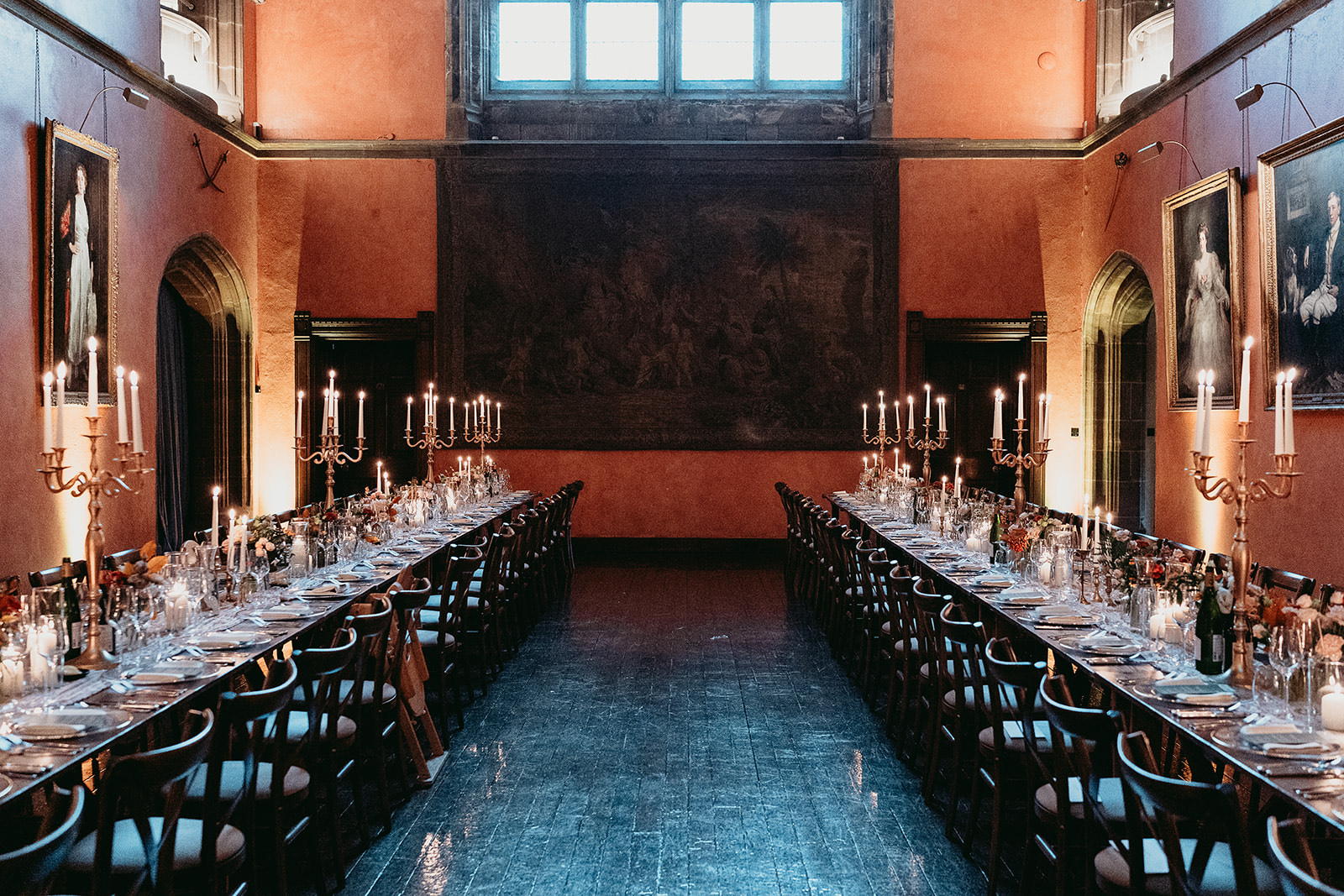 Candlelit winter wedding breakfast inside Cowdray House