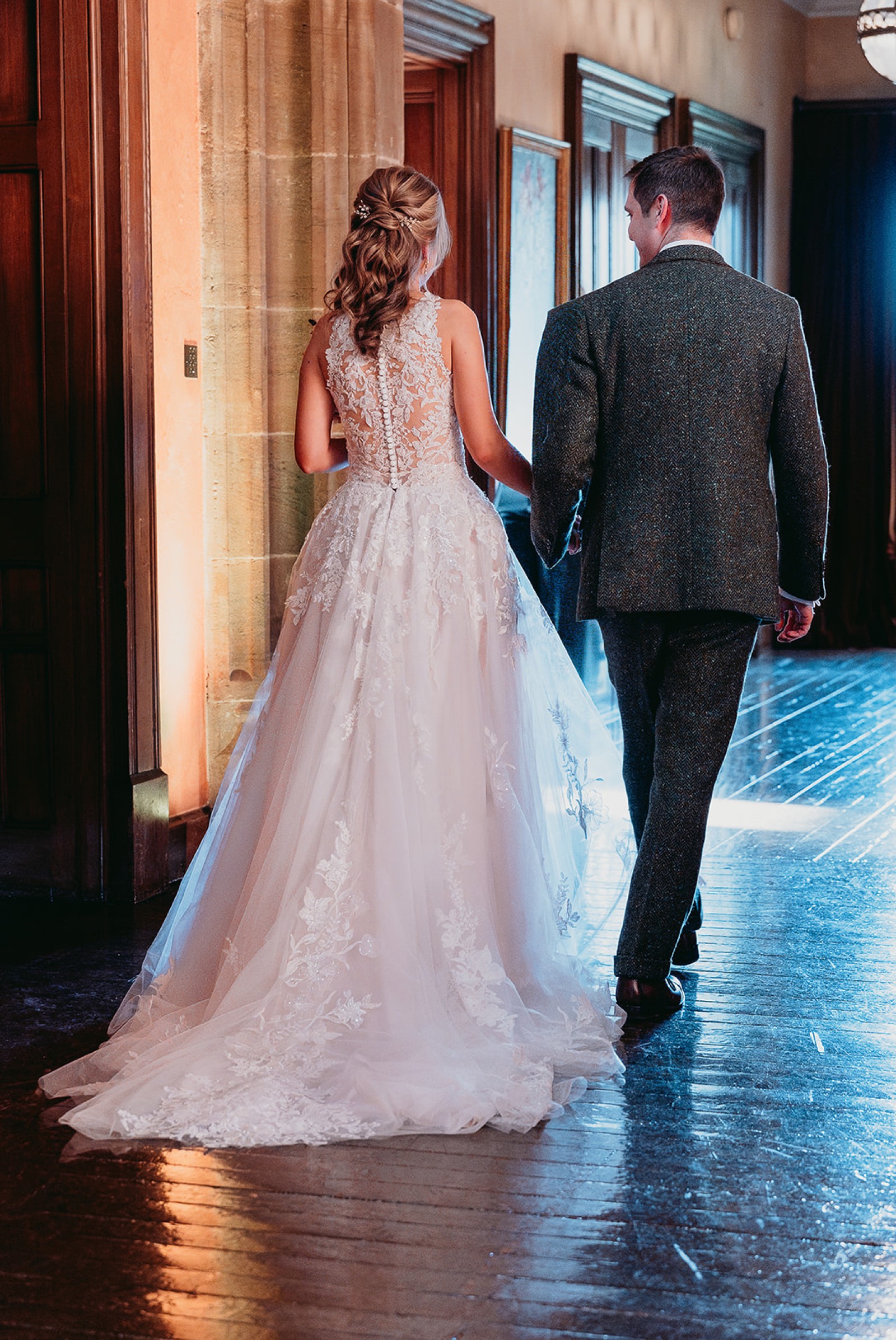 Newlyweds walking back through the house after their ceremony