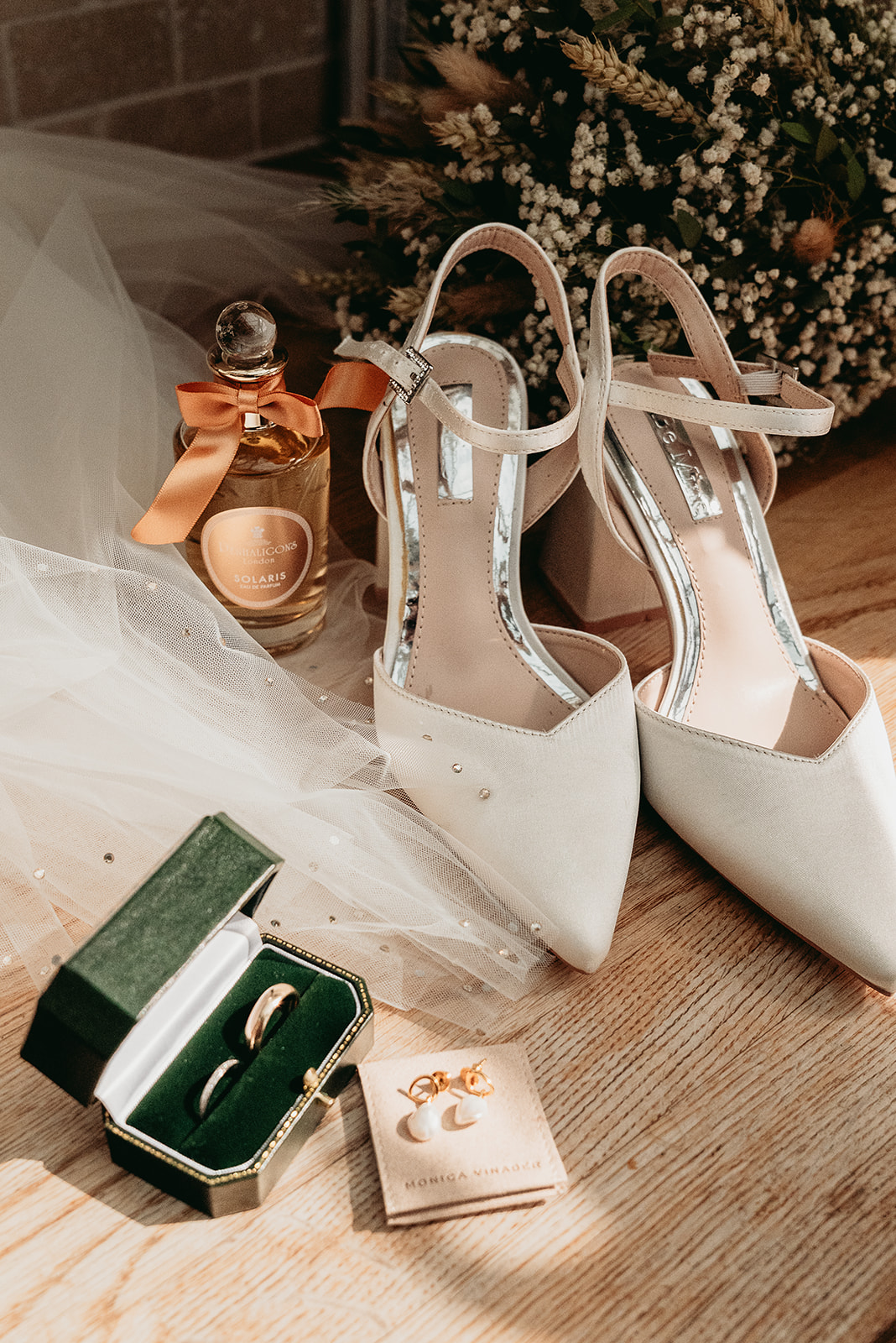 Colourful wedding shoes and personal details arranged during morning preparations at Fitzleroi Barn