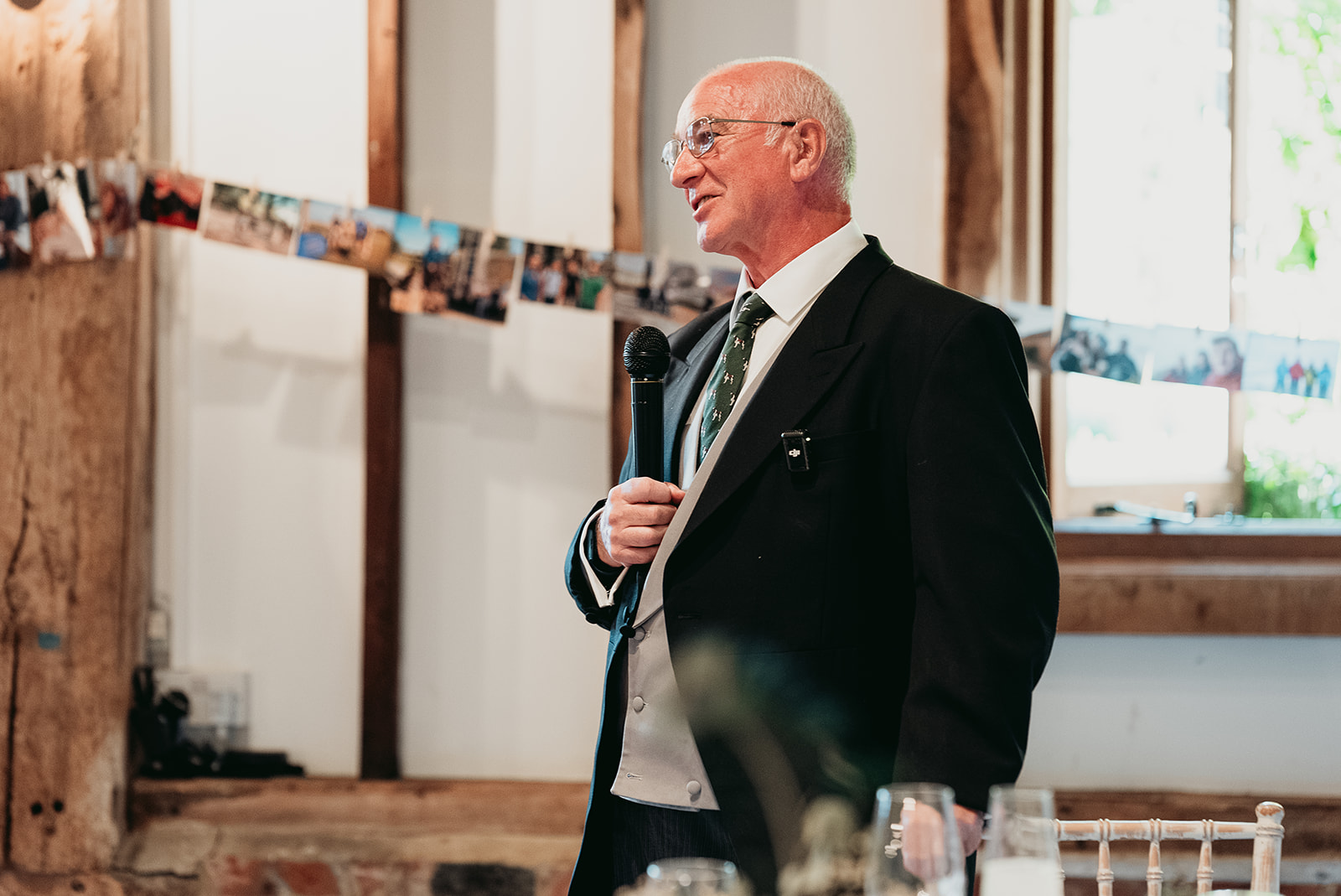 A joyful speech reaction during Jodie and Jordan's Fitzleroi Barn wedding breakfast