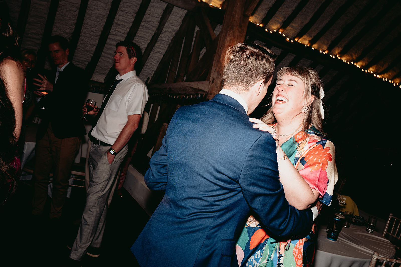 Joyful wedding dance floor energy at Fitzleroi Barn in West Sussex