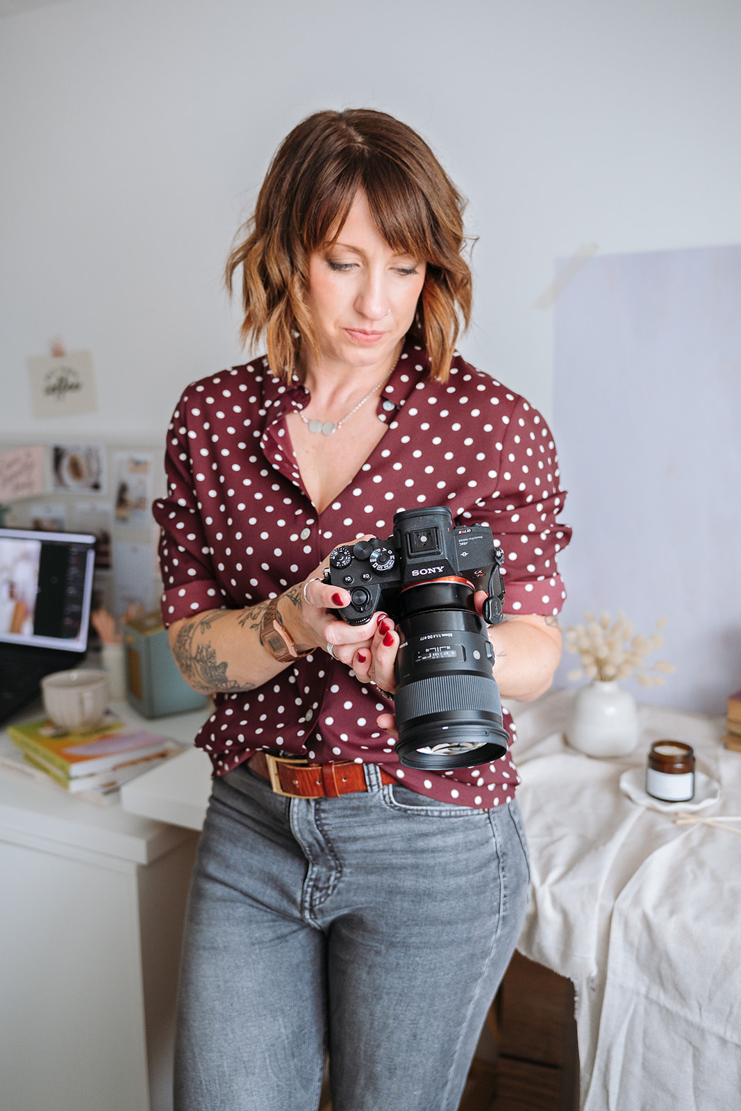 Branding portrait of AnySomething photographer Laura-Anne Sutcliffe holding her camera