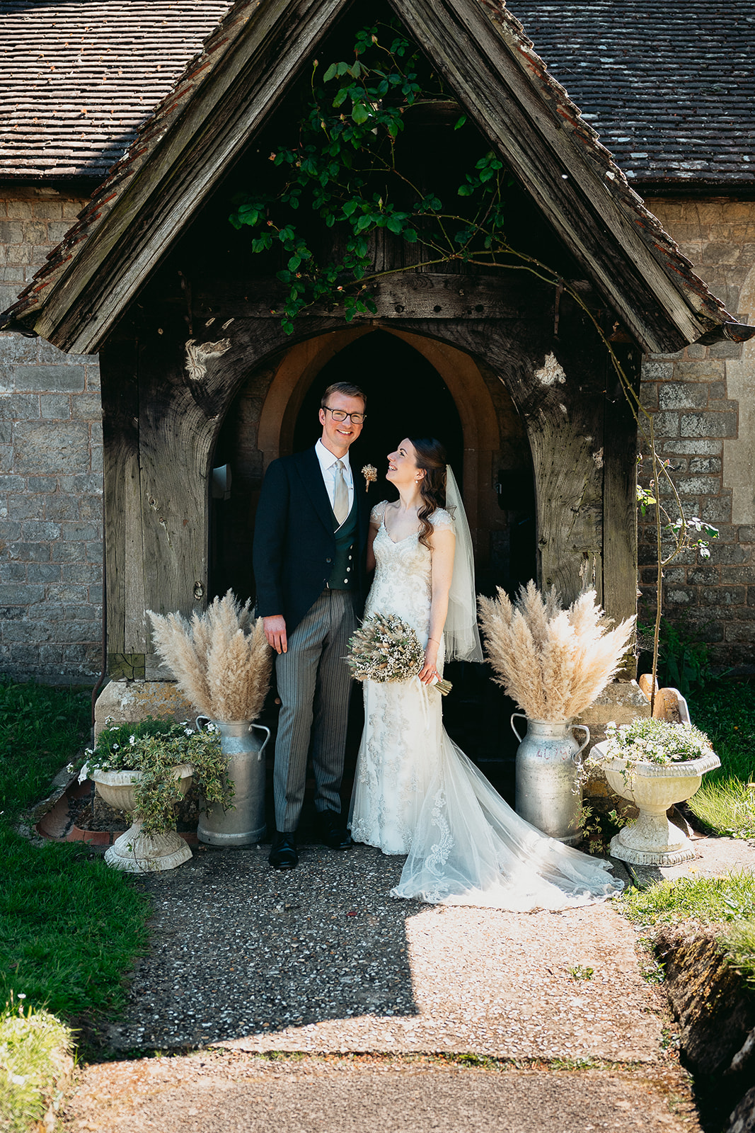 Jodie and Jordan leaving their historic West Sussex church as newlyweds
