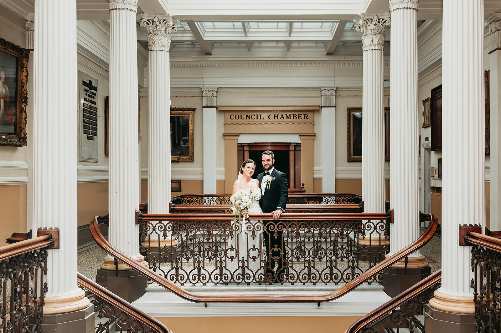 Samantha and Adam on the historic staircase outside the Council Chamber at Brighton Town Hall